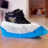 Disposable Shoe Covers. Pack of 50 White Shoe Covers for Indoors with Blue Non Slip Sole. Universal Size. CPE Shoe Booties Disposable. Waterproof Doub